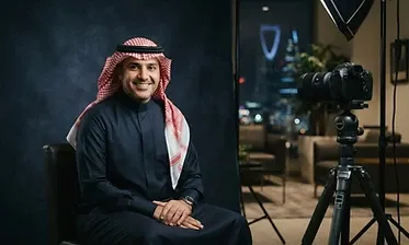 Corporate photographer shooting an executive portrait in a Riyadh office
